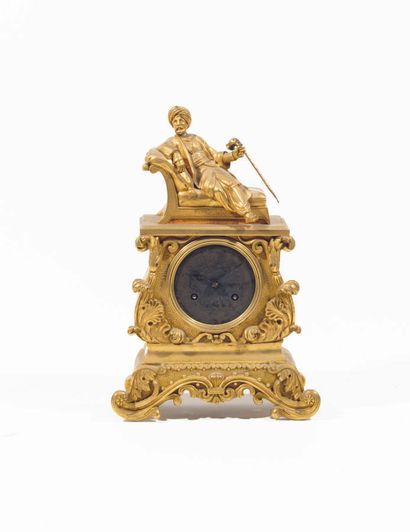 Clock in chased and gilded bronze; the cover...