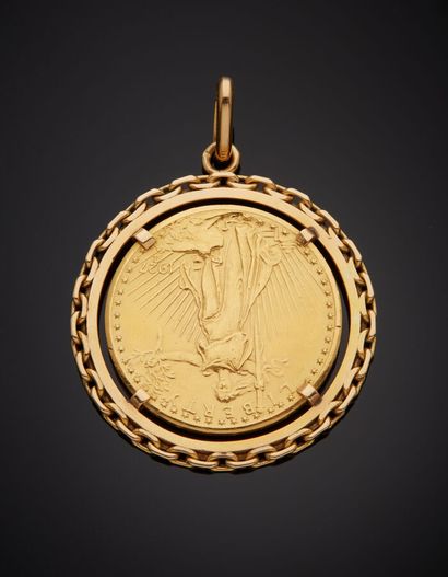  Yellow gold (750‰) openwork circular pendant, bordered by a "chain" design, holding...