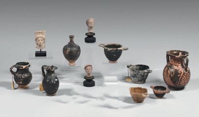 null Eight vases, including a pliké with female and satyr profiles, and three statuette...