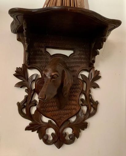 null Small carved wooden wall console decorated with a dog's head in an escutcheon...
