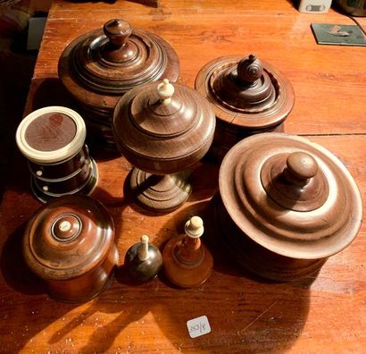 null Set of eight turned wooden pieces: boxes, bottles, covered chalice; some with...