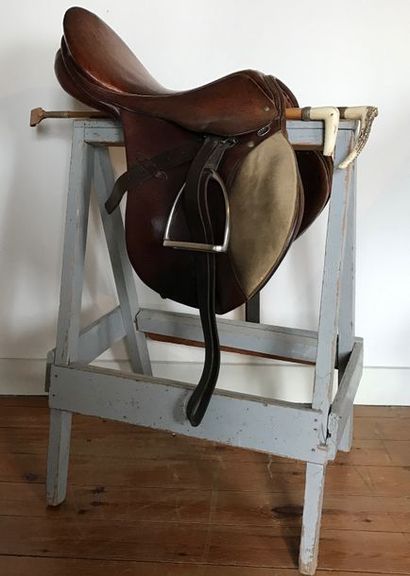 null Leather horse saddle JOSEF MOLL.
Two whips are attached, the handle is made...