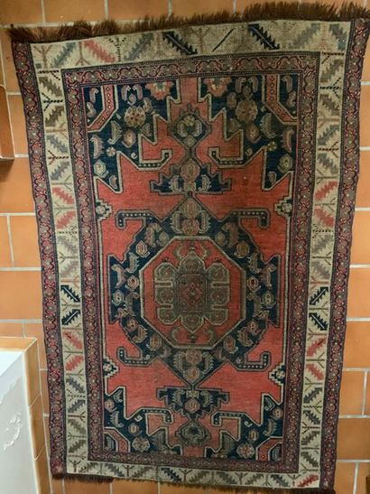 null Wool oriental rug with stylized decoration of a diamond with four hooks on a...