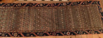 null Woolen oriental gallery carpet decorated with small flowered lozenges.
241 x...