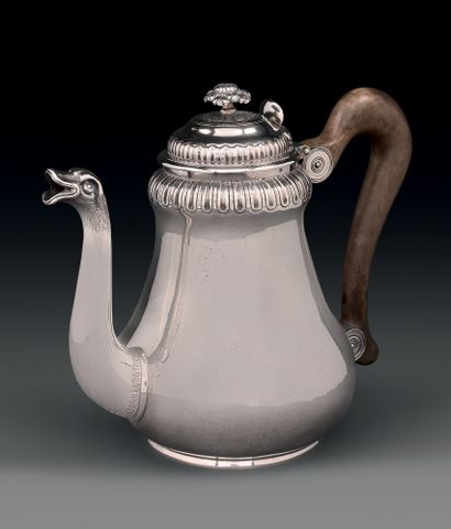 null Silver teapot, of baluster form, posed on a frame, decorated under the neck...