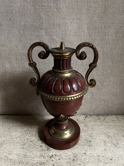 null Lamp stand in the shape of a baluster vase in griotte marble carved with gadroons...