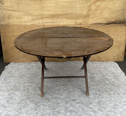 null 
Pair of stained natural wood tables, the round top on a folding base. English...