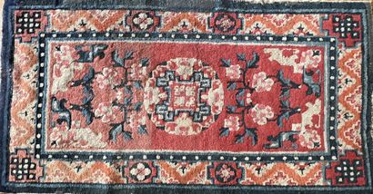 null Small carpet from China with a coral red background. Decorated with a central...