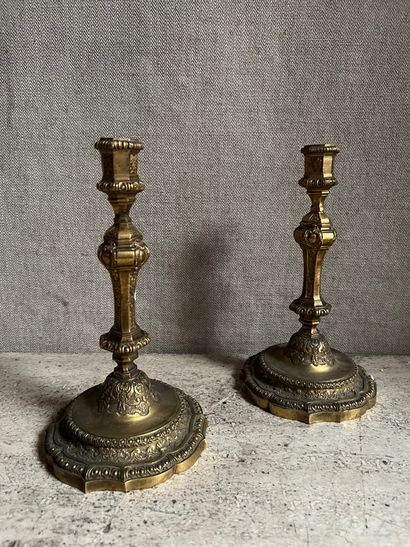 null Pair of bronze torches decorated with canals, quatrefoils, cartouches, oves,...