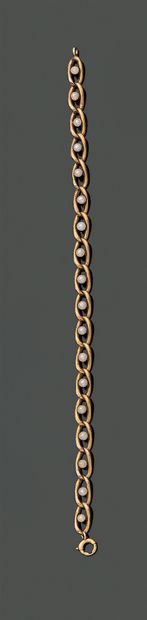 null Articulated bracelet in 18K (750) yellow gold, with gourmette links each adorned...