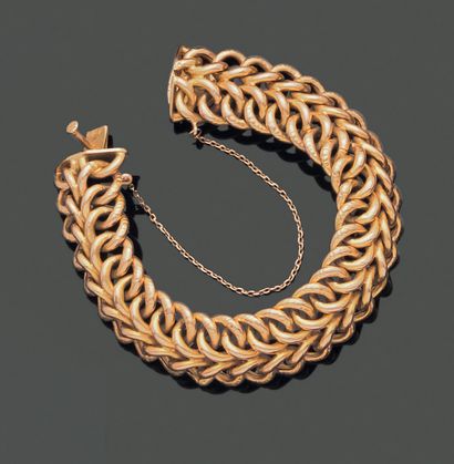 null Articulated bracelet in 18K (750) yellow gold, formed of double meshes partially...