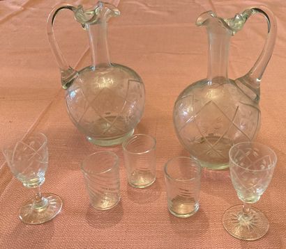 null Suite of liqueur glasses, the chalice with stylized green enamel decoration...