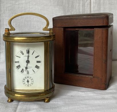Travel clock with cage in bronze of oval...