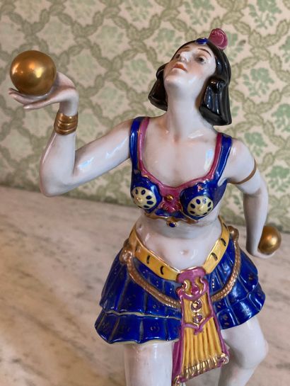 null Porcelain statuette enhanced with polychromy and gilding, representing a dancer...