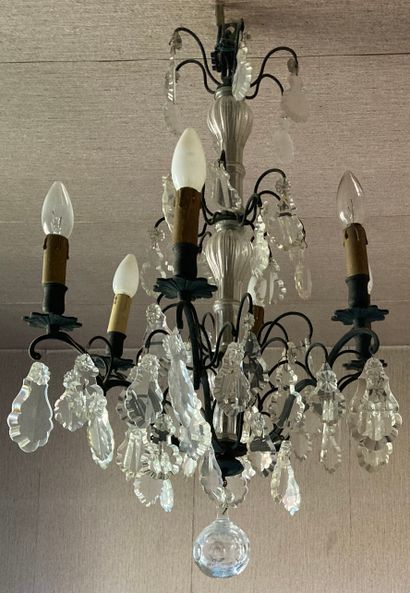 null Chandelier, the frame in patinated metal, the shaft furnished with crystal balusters....