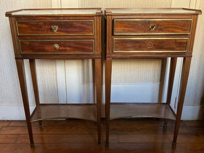 null Pair of mahogany and mahogany veneer bedside cabinets with brass moldings. The...