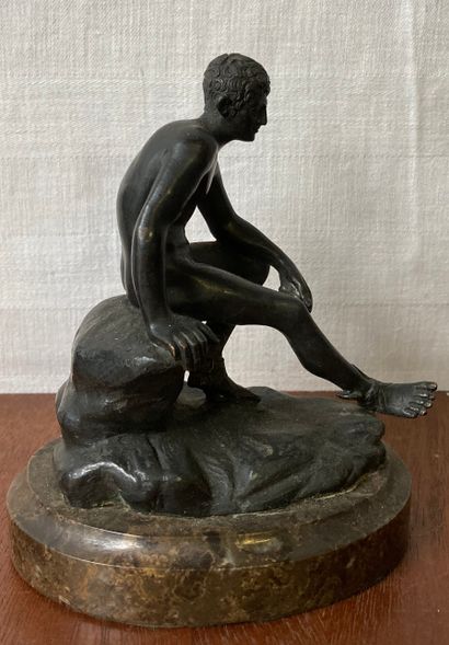 null Statuette in patinated bronze representing Mercury sitting on a rock. Oval marble...