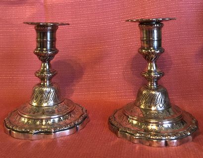 null Pair of small silver plated bronze torches, the contoured base with twisted...