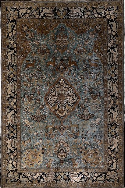 null Persian carpet in wool and silk decorated with a central mandorla, surrounded...