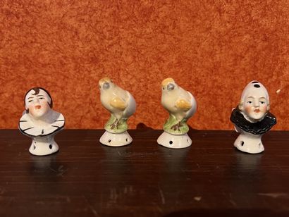 null Suite of four polychrome porcelain powder box handles featuring a dove, a pierrot...