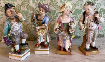 Two pairs of polychrome porcelain statuettes...