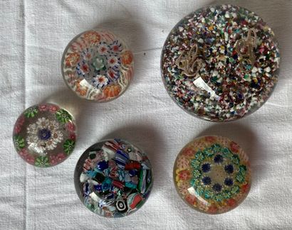 null Five paperweights with millefiori decoration. A sixth one in bad condition is...