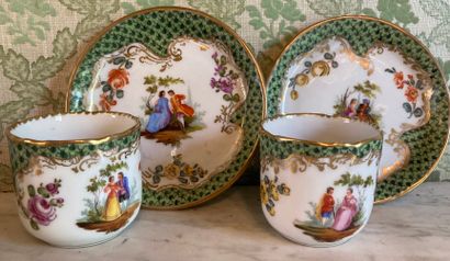 null Porcelain trinkets: pair of cups and their saucer decorated with gallant couples...