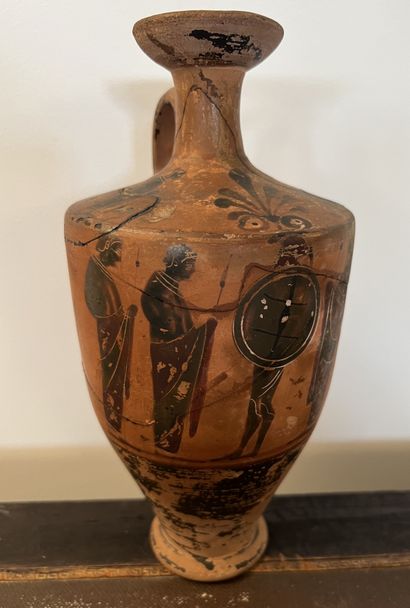 null Terracotta oenochoe with black figures decorated with a frieze of characters...