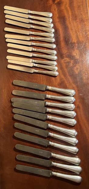 null Set of eleven knives and twelve cheese knives, the handles in plain silver plated...