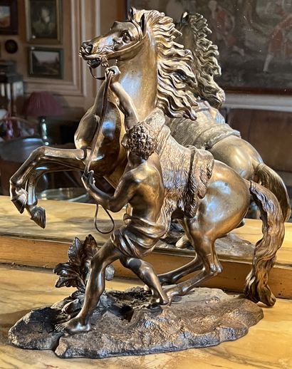 null After Guillaume COUSTOU for Marly, Horse and Groom. Group in patinated and gilded...