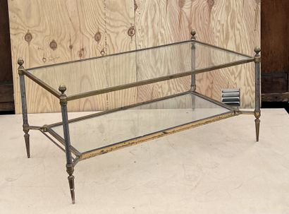 null Low table in brass and gilded metal of rectangular form. The uprights with gunmetal...