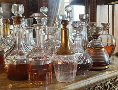 null Set of decanters and bottles in glass or molded crystal.