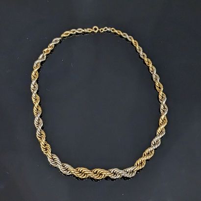 null Necklace in yellow and white gold 18K (750), the twisted links interlaced. Weight...