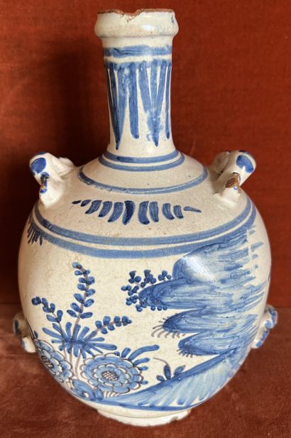 null Earthenware pilgrim's flask with blue camaïeu decoration of flowers and flowered...