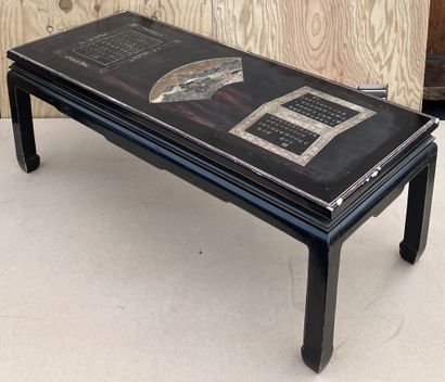 null Rectangular coffee table in black lacquer. The top decorated with a landscape...