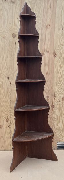 null Corner shelf in fruitwood with six decreasing size shelves on cut-out uprights....