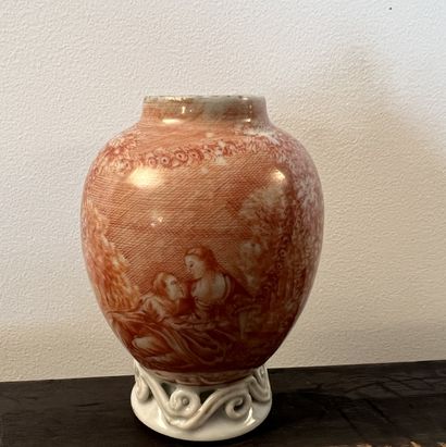 null Small ovoid porcelain vase decorated in coral cameo with a gallant scene surrounded...