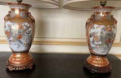 null Pair of Japanese porcelain vases with polychrome decoration and enhanced with...