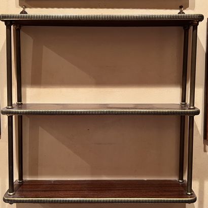 null Wall shelf with three mahogany veneer trays joined by small brass uprights....