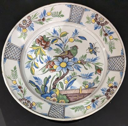 null Saint-Amand, 18th century. Enameled earthenware dish with polychrome decoration...