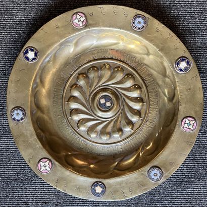 null Brass quest dish, the umbilicus decorated with an enamelled medallion surrounded...