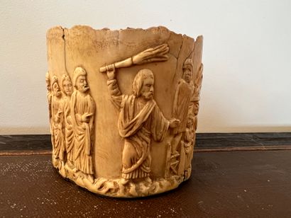 null Oval bone base with carved decoration in bas-relief representing Christ driving...