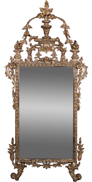 null Mirror with gilded wood frame and silver patina, the pediment cut out decorated...