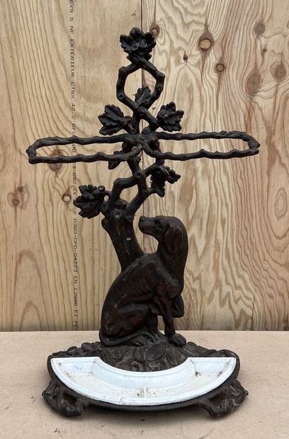 null Cast iron umbrella stand featuring a dog at the foot of a tree, the branches...