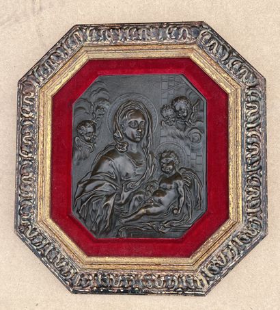 null Patinated bronze plate of rectangular form with cut sides representing the Virgin...