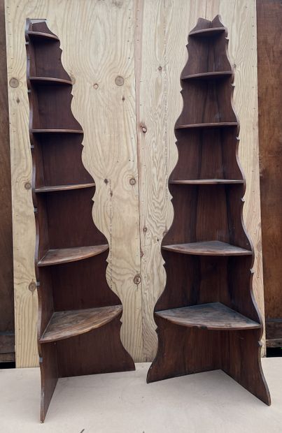 null Pair of corner shelves in fruitwood, with six decreasing size shelves on cut-out...