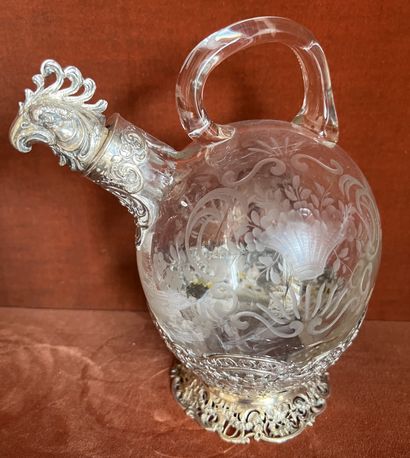 null Globular decanter with handle out of crystal with decoration of flowered basket...