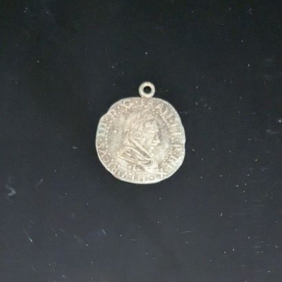 null Henri III silver coin, mounted in pendant. Soldering.
