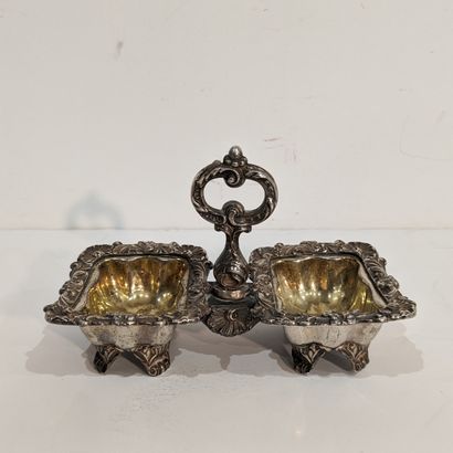 null Double silver-plated saleron with rocaille decoration. The inside of the receptacles...