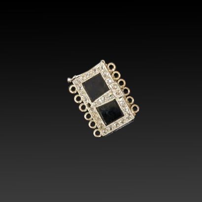null Platinum clasp adorned with two black onyx quadrangular elements set in rose-cut...